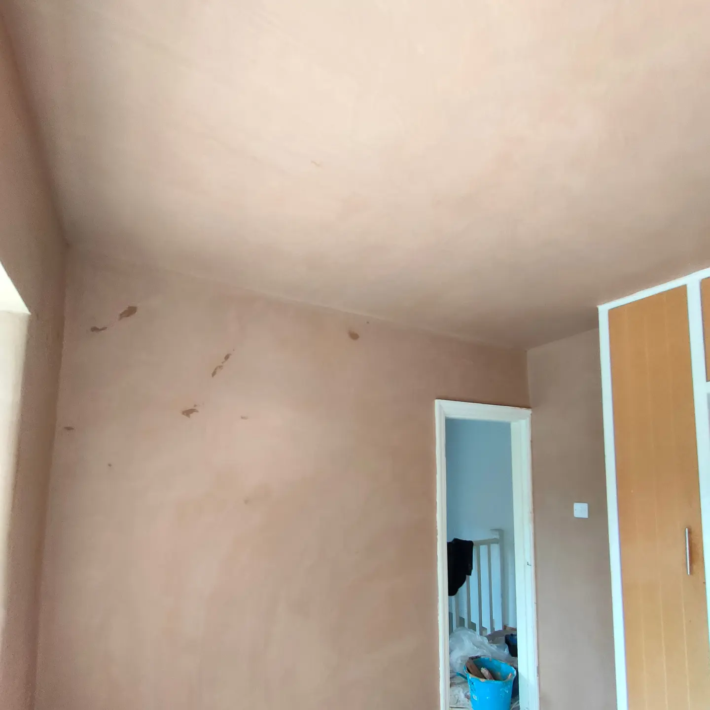 Bedroom with freshly plastered walls and ceiling